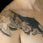 Chris DeLauder Tattoo Artist black and grey wings flowers full chest