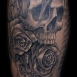 Chris DeLauder Tattoo Artist black and grey skull and rose