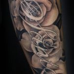 Emily Graven Tattoo Artist black and grey rose and name