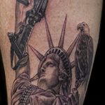 Chris DeLauder Tattoo Artist black and grey statue of liberty rifle eagle